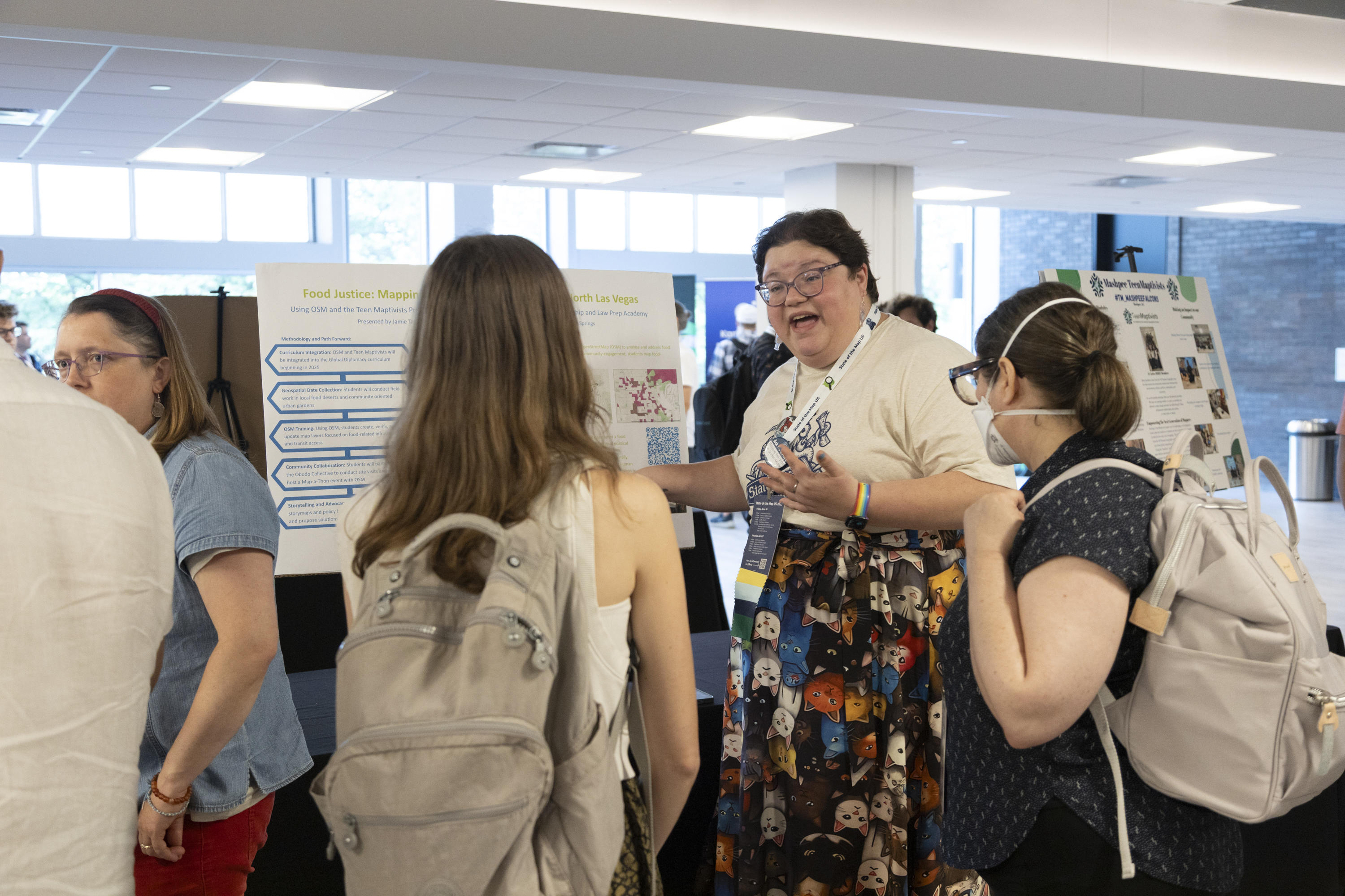 Jamie with their poster during the poster session